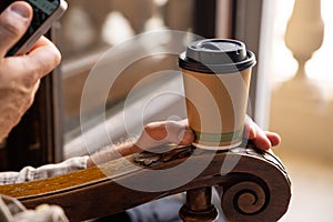 Man drinking coffee from disposable cup