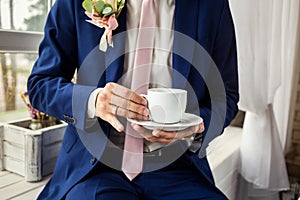 Man drinking coffee at home