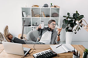 Man drinking coffee at workplace