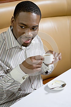 Man drinking expresso.