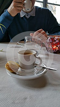 Man drinking expresso coffee in restaurant