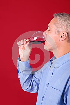 Man drinking a glas of red wine