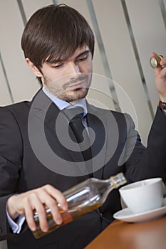 Man drinking by office work