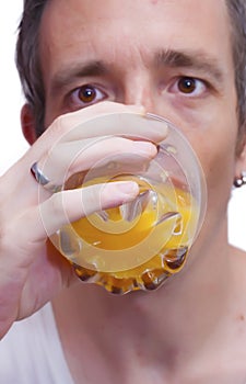 Man drinking orange juice