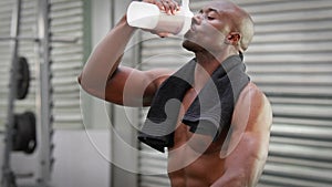 Man drinking protein shake at crossfit gym