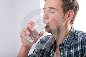 Man drinking water.