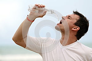 Man drinking water from bottle