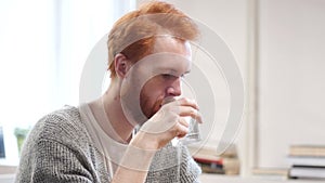 Man Drinking Water in Glass