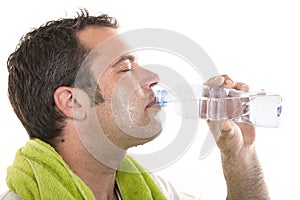 Man drinking water and sweating photo
