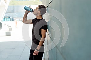 Man drinking water after training