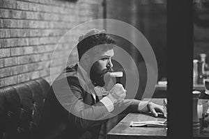 Man drinks cognac. Beer time. Man drinking beer in restaurant at meeting or date