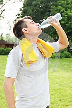 Man drinks water from a bottle