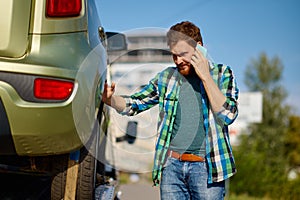 Man driver discussing occurrence by mobile phone