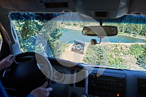 Man driving a 4WD along a dirt road