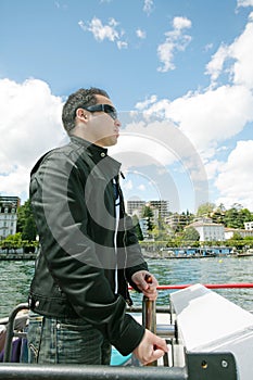 Man driving a boat in a beautiful landscape