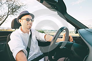 Man driving cabriolet car by province mountain road inside car view