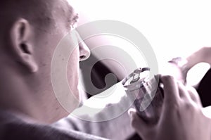 Man driving a car drinking energizing drink photo