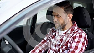 Man driving car, eyesight problems, poor vision, tiring journey, accident risk photo