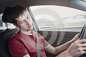 Man driving car and fell asleep and does not control the road situation. Drugged with alcohol or insomnia concept. Car crashes and