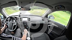 Man driving a car with gps navigation system