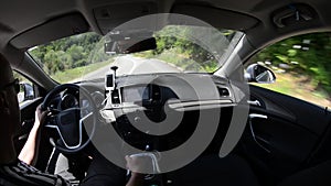 Man driving a car with gps navigation system