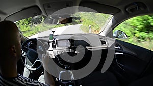 Man driving a car with gps navigation system