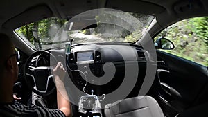 Man driving a car with gps navigation system