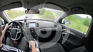 Man driving a car with gps navigation system