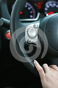 Man driving car with his hand on the steering wheel