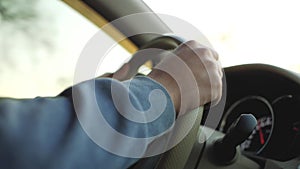 Man driving a car.man`s hand on the steering wheel of a car