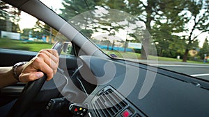 Man driving a car moving fast on a highway