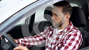 Man driving car with seat belt not fastened, safety on road, accident risk