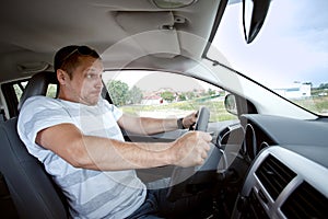 Man driving car , speeding fast.