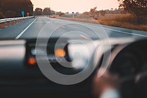 Man driving car in urban road, travelling concept