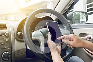 Man driving car and using mobile phone