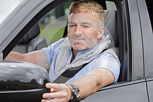 Man driving fitting side car mirror