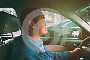 Man driving his car in the street