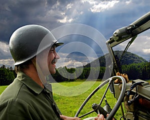 Man driving military jeep