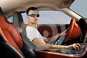 Man driving modern sport car