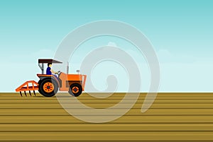 The man is driving a orange tractor. In order to plow the soil in the field.