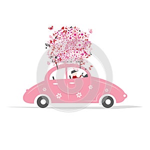 Man driving pink car with floral bouquet on roof