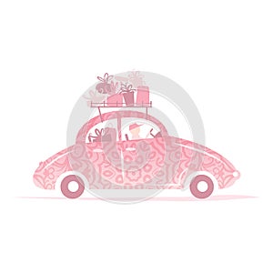 Man driving pink car with gifts on roof