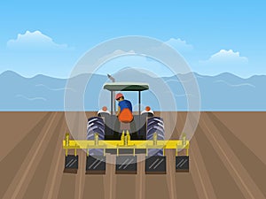 man is driving tractor. In order to plow the soil in the field. Have a blue sky background