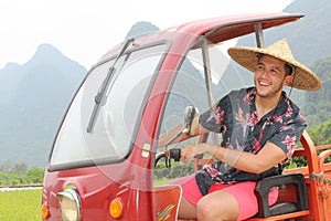 Man driving a tuk-tuk in Asia