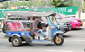 Man driving tuk tuk in Bangkok