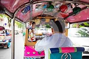 Man driving Tuk Tuk car