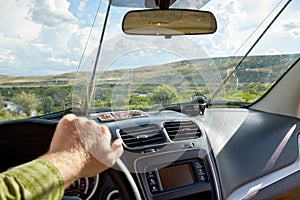 Man driving a vehicle off road on a fishing trip