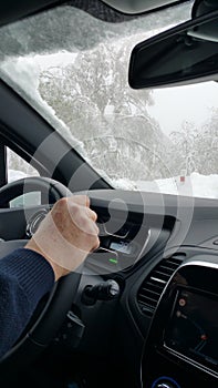 Man driving in winter conditions