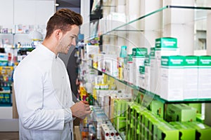 Man druggist in pharmacy