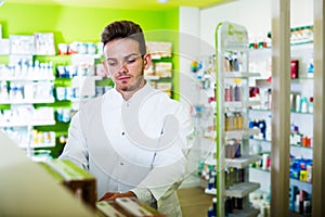 Man druggist in pharmacy